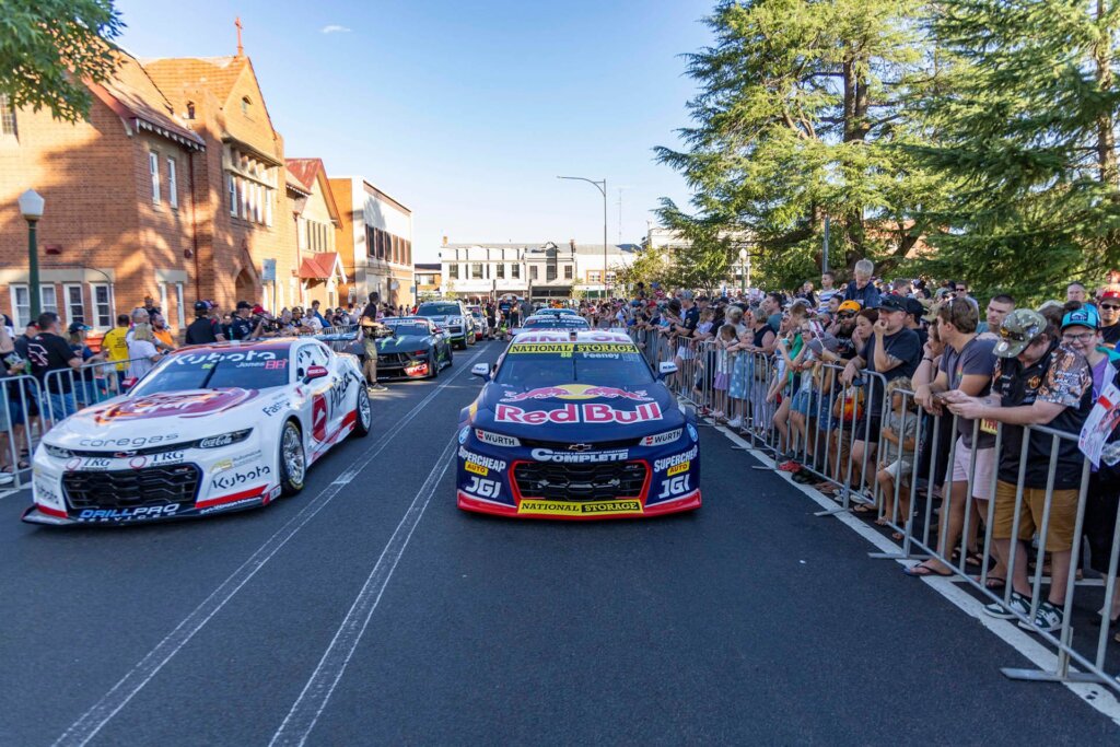 Fans line the streets of Taupo as the Supercar do their parade thingy before race day.