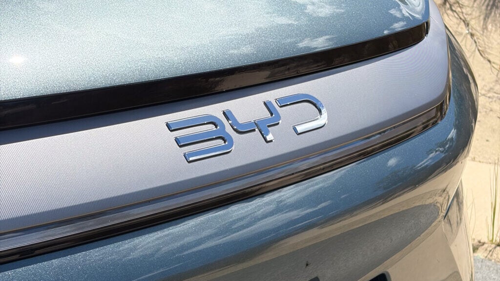 BYD badge on a greenish car