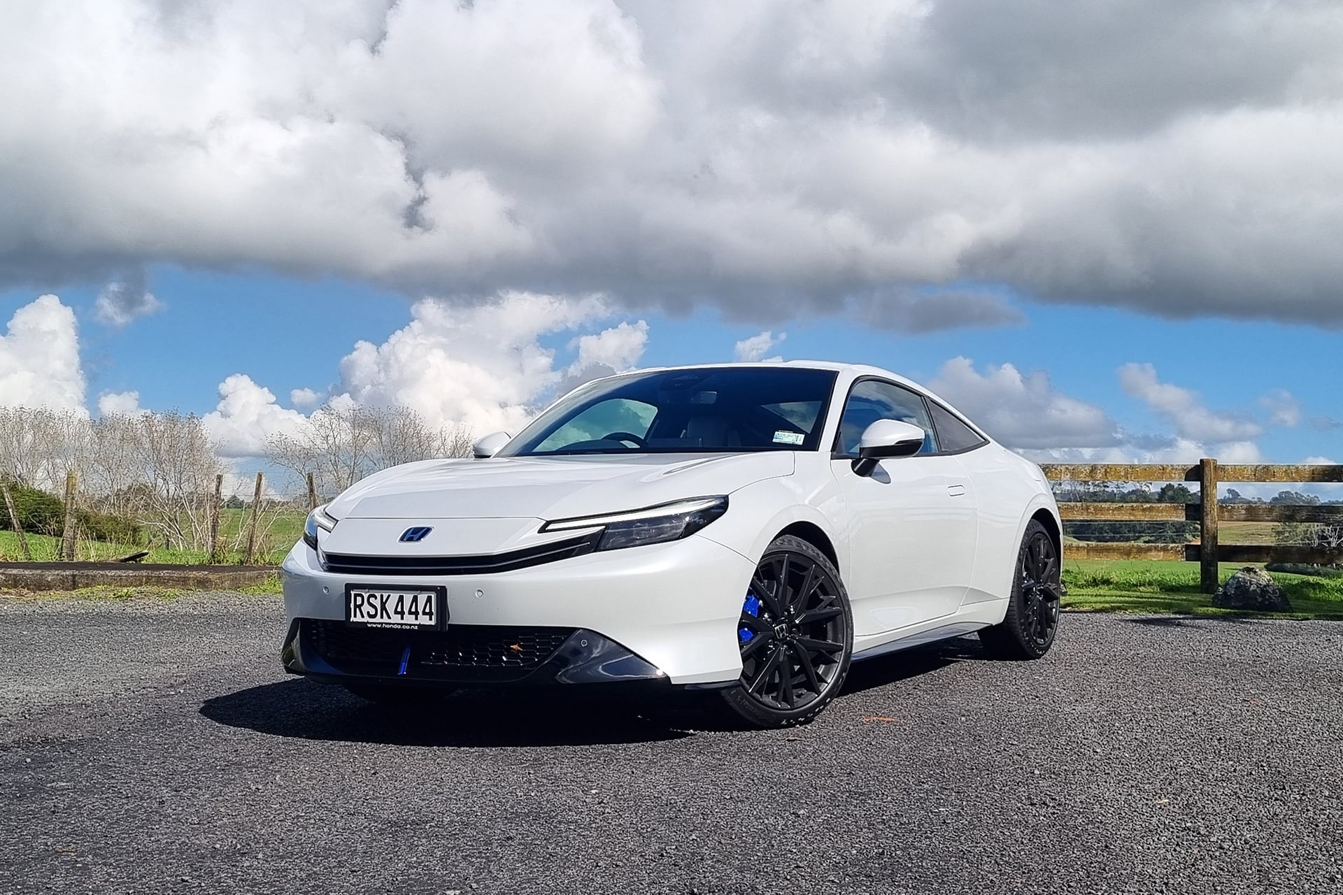Honda Prelude in white under the cloud
