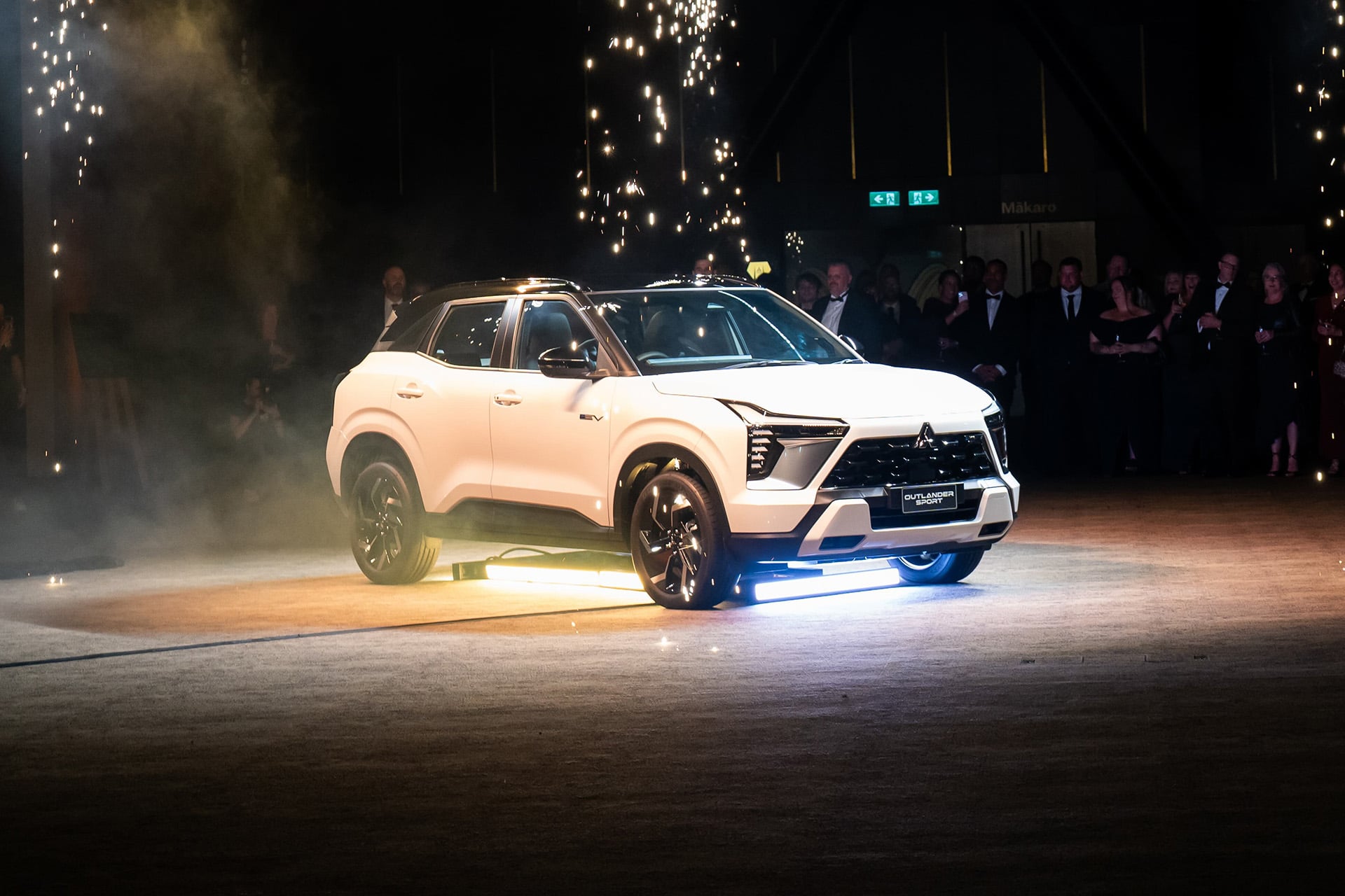 Outlander Sport HEV in white under lights