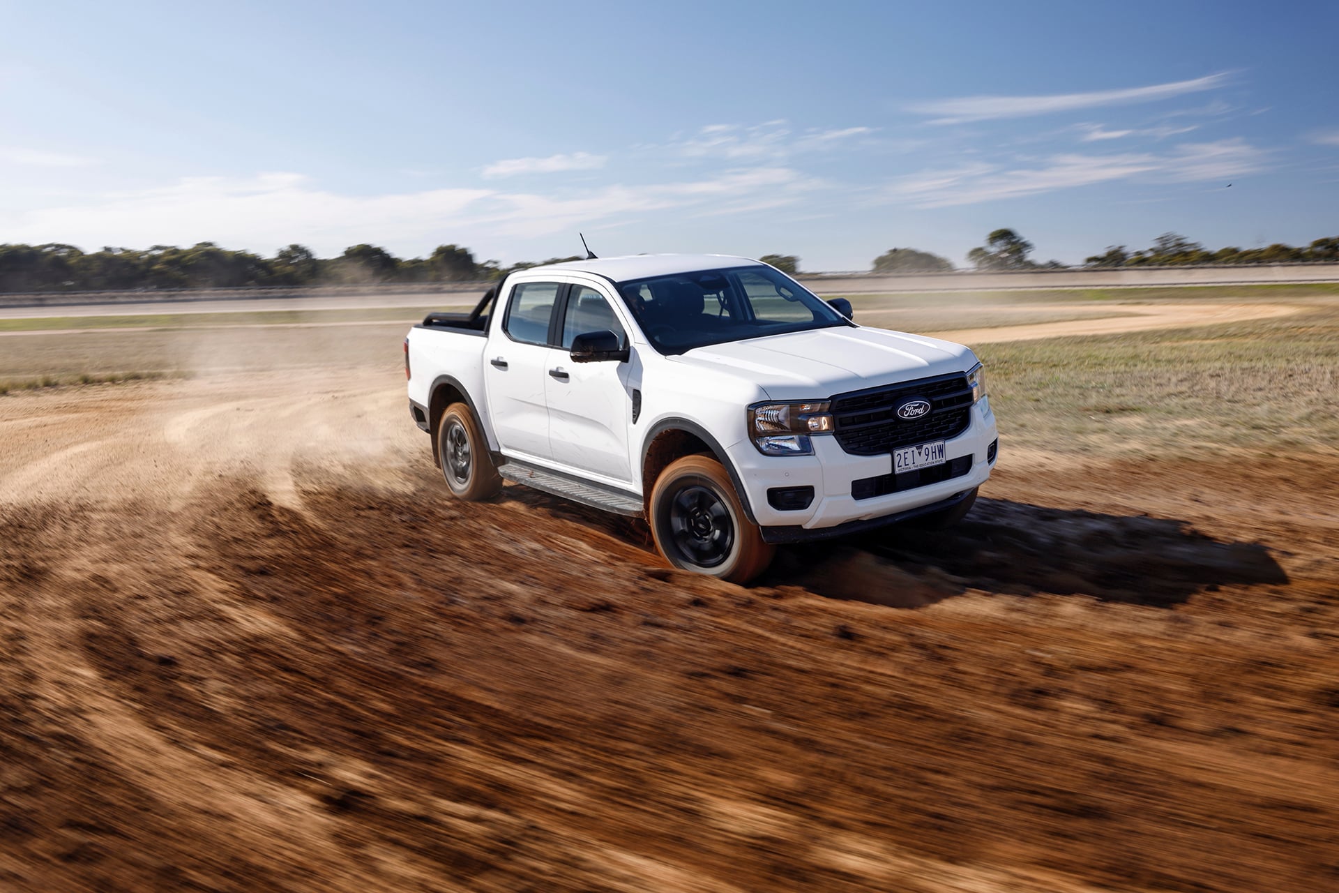 White Ford Ranger in the dirt