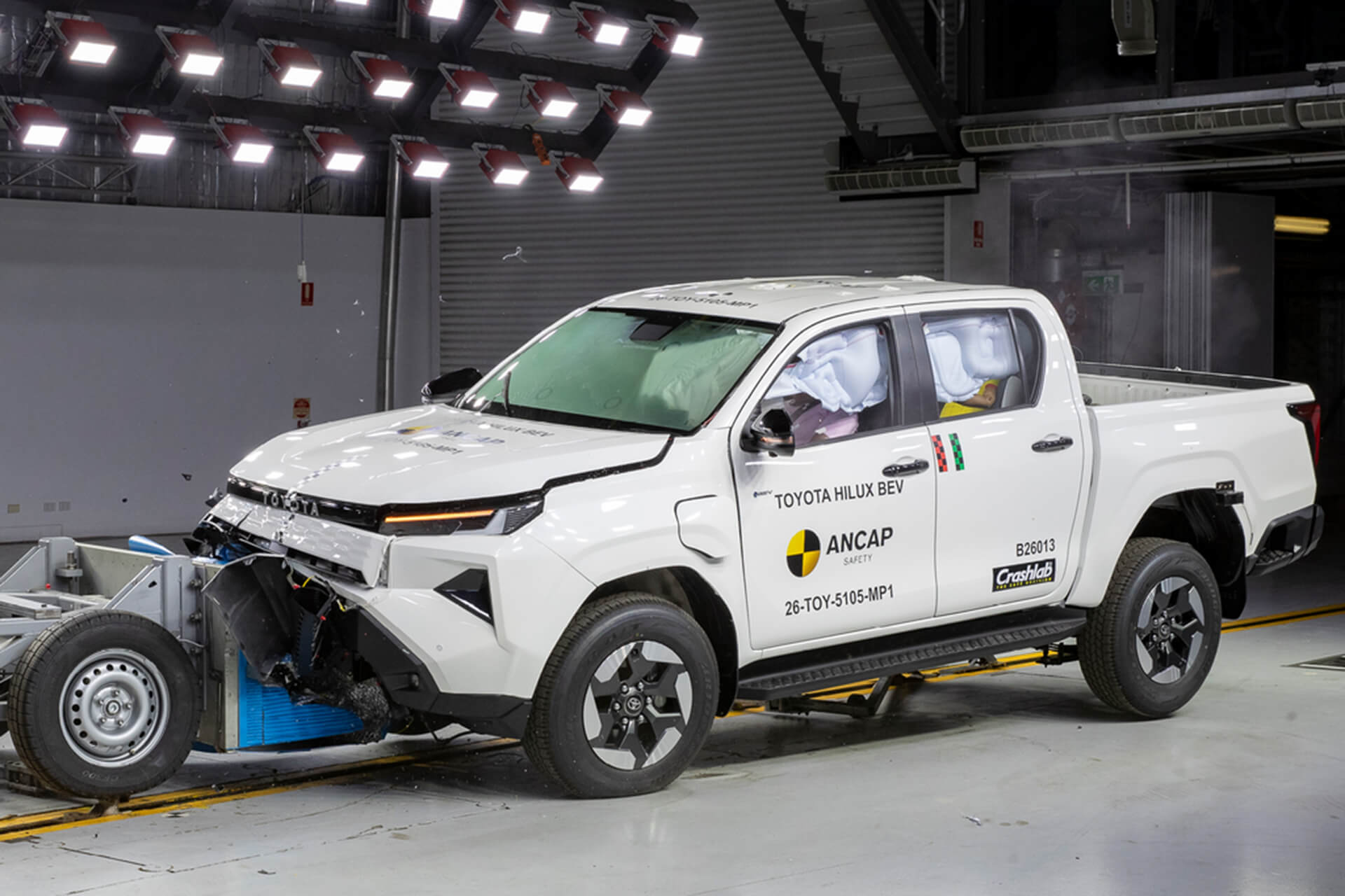 White Hilux BEV crashing