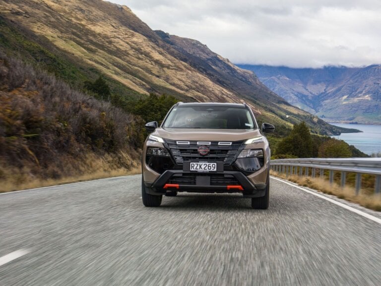 2026 Nissan X-Trail Rock Creek in Baja Storm driving on a lakeside road