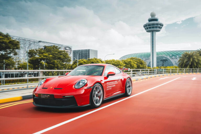 red porsche on a red road