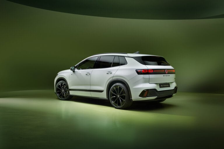 white VW SUV on a green background