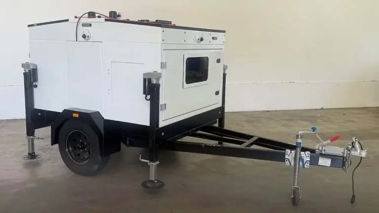 NZ Transport Agency Waka Kotahi new smaller white mobile speed camera trailer, side view, with stabiliser legs lowered