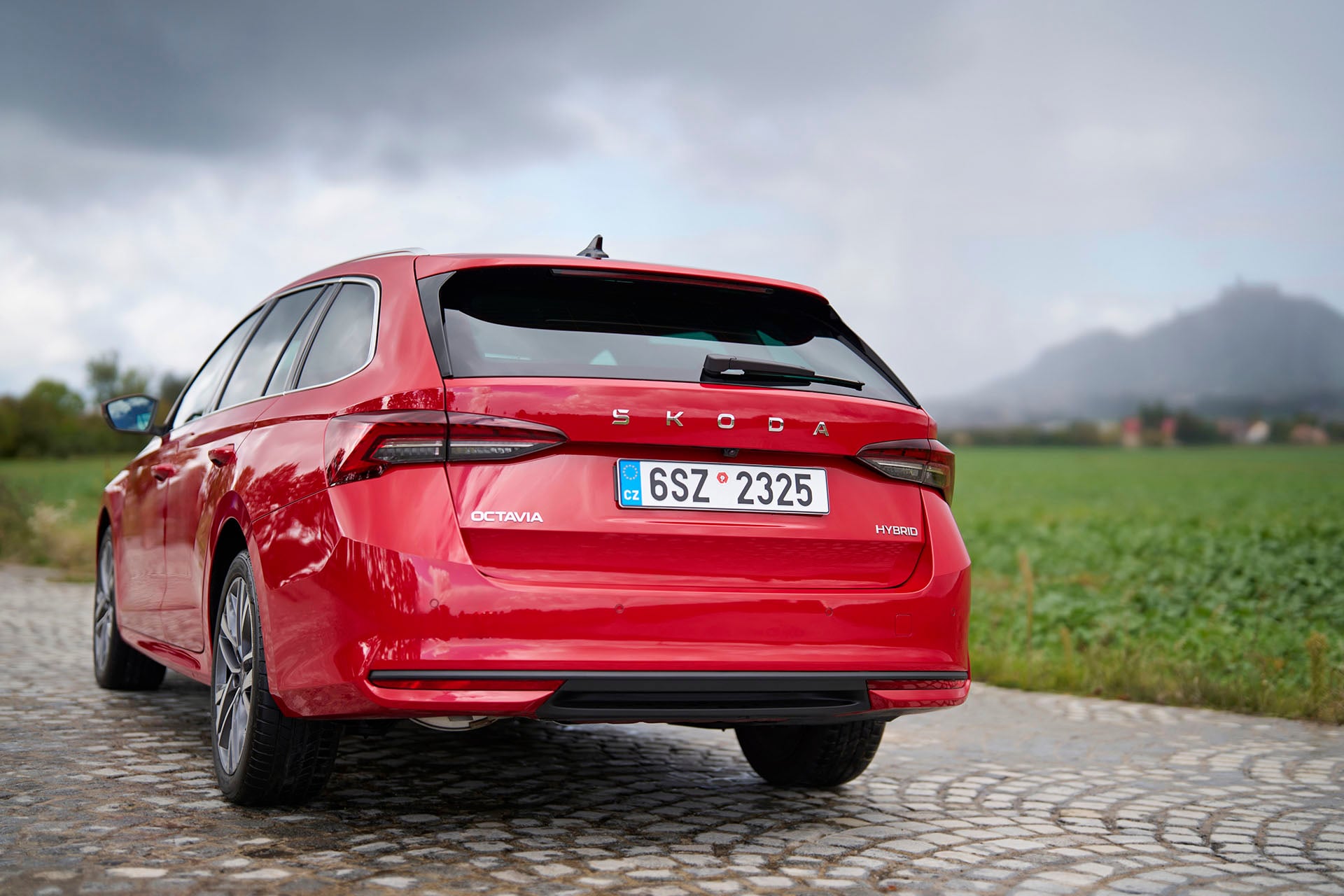 Red Skoda on cobblestones